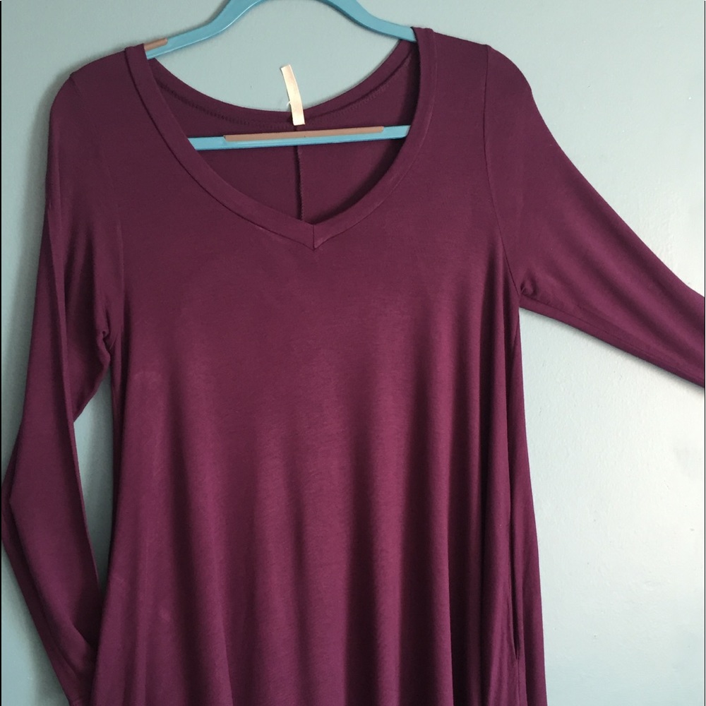 Long sleeve, 2 pocket, A-line shaped blouse/dress.